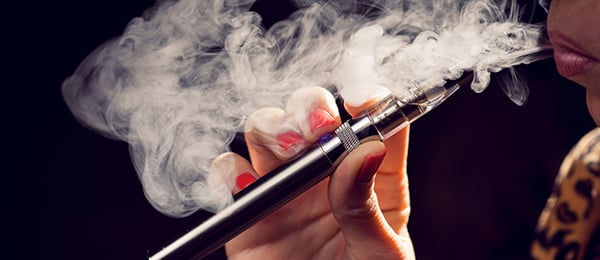 Woman smoking an e-cigarette