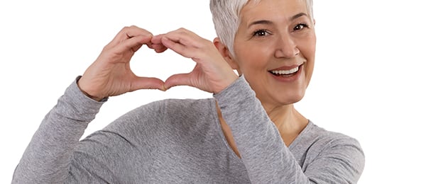 Woman making heart shape with her hands