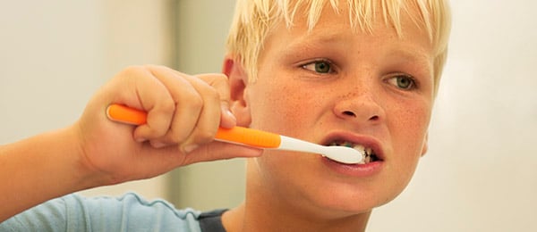 boy brushing his teeth
