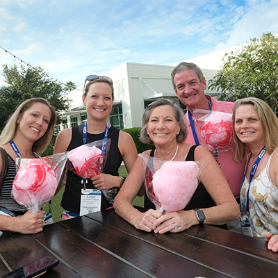 Happy SmileCon attendees with cotton candy