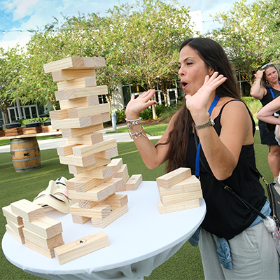 SmileCon attendee and a giant Jenga puzzle