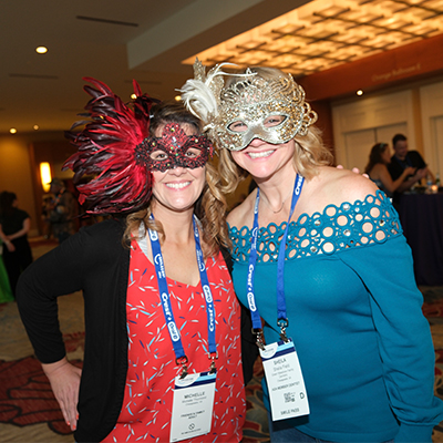 Two SmileCon attendees in masks