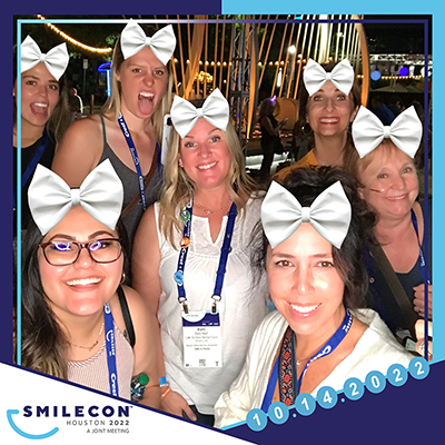 Smiling Attendees at SmileCon 2022 in silly photo filer